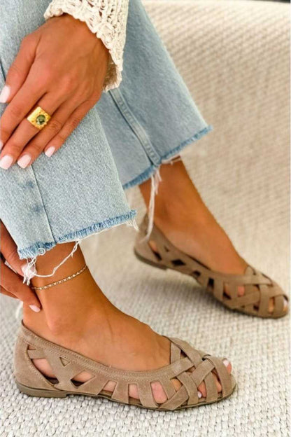 Open-toe flat sandals with crisscross woven straps