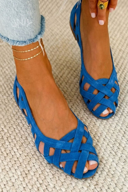 Open-toe flat sandals with crisscross woven straps