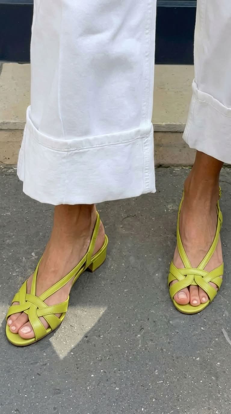 Nude leather slingback sandals with crisscross straps and a low heel
