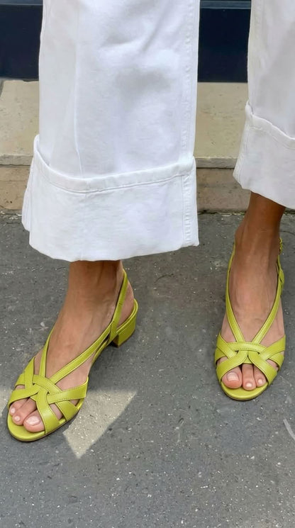 Nude leather slingback sandals with crisscross straps and a low heel