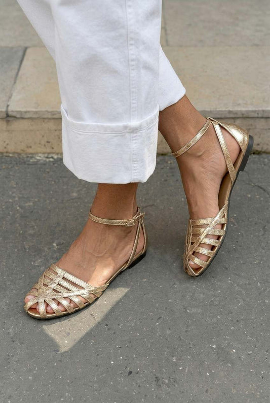 Braided flat sandals with closed toes and an ankle strap