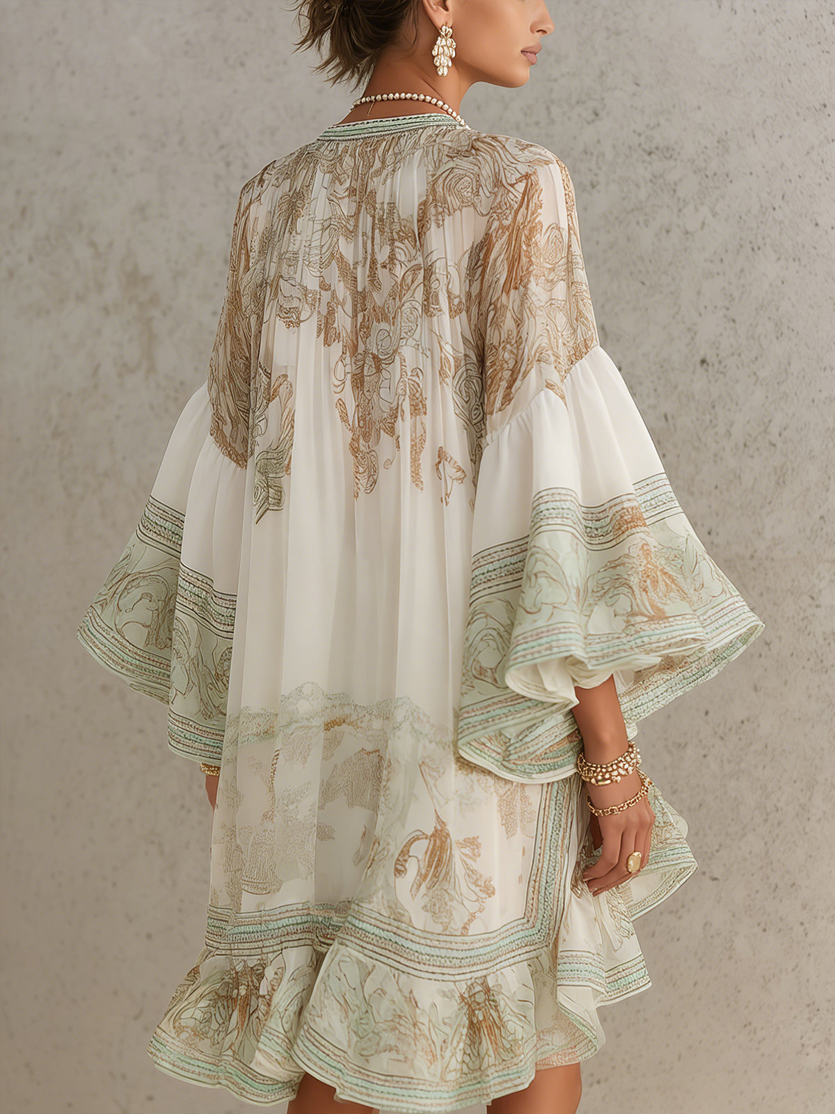 Solange | Short asymmetric green muslin dress with ruffles and bell sleeves