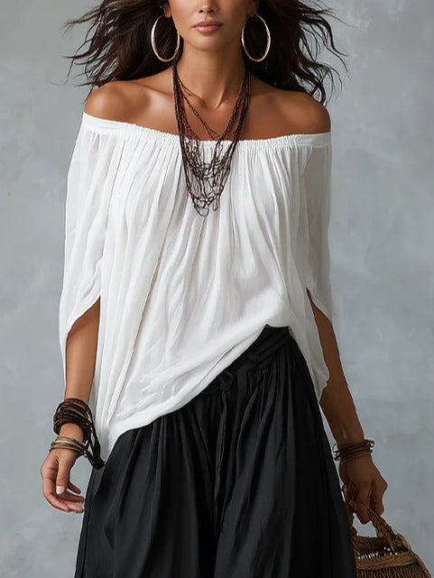 White off-the-shoulder top and lantern-style flared pants set