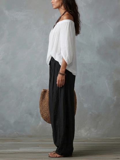 White off-the-shoulder top and lantern-style flared pants set