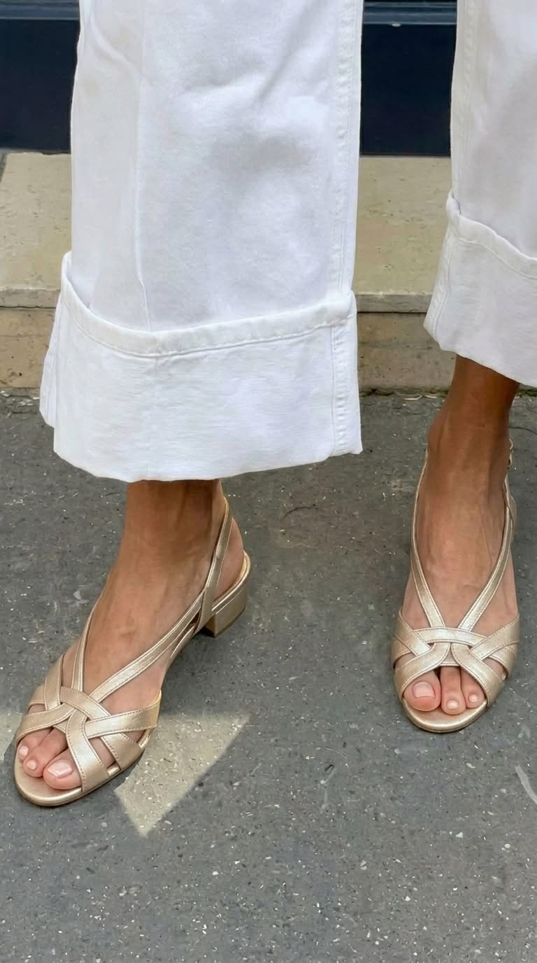 Nude leather slingback sandals with crisscross straps and a low heel