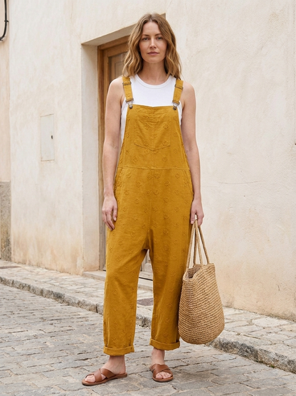 Yellow linen dungarees worn outdoors